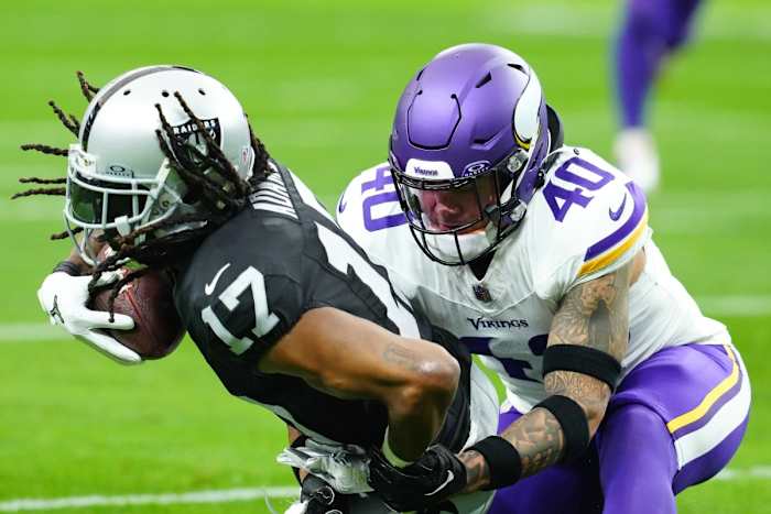 Dec 10, 2023; Paradise, Nevada, USA; Las Vegas Raiders wide receiver Davante Adams (17) is tackled by Minnesota Vikings linebacker Ivan Pace Jr. (40) during the first quarter at Allegiant Stadium.
